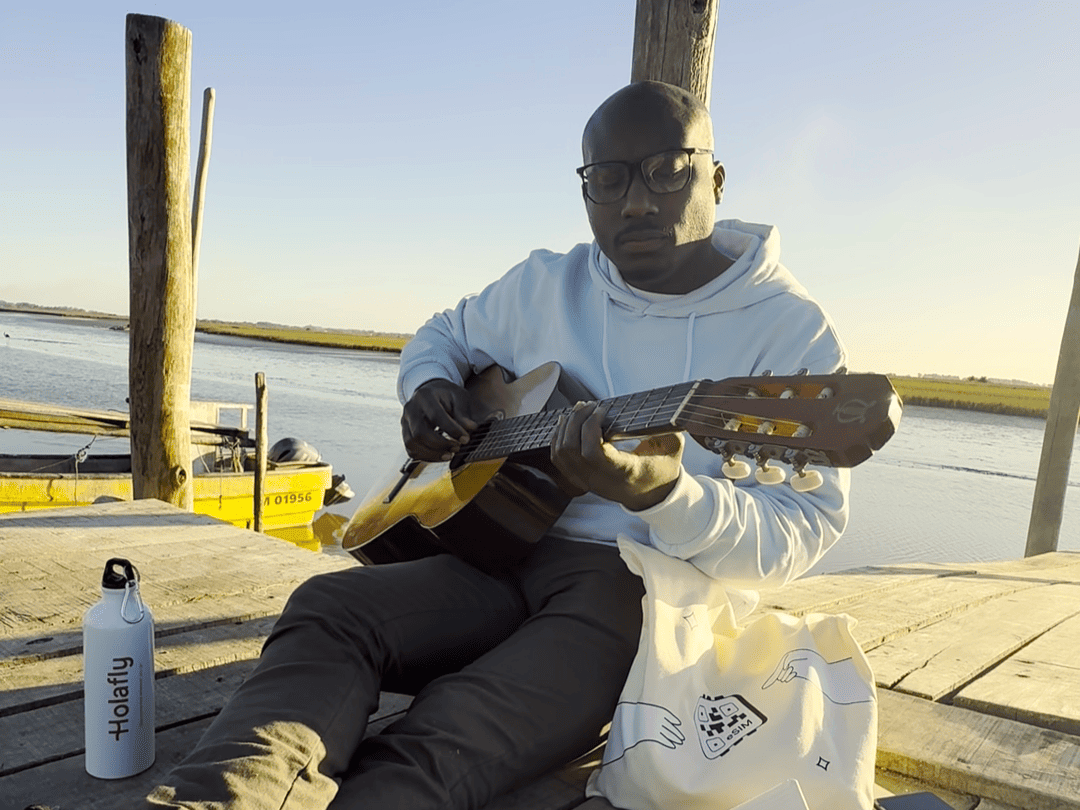 Paultre playing guitar in his free time.png