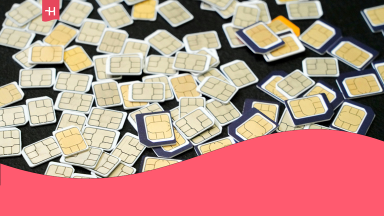 Multiple colorful physical SIM cards scattered randomly against a black background