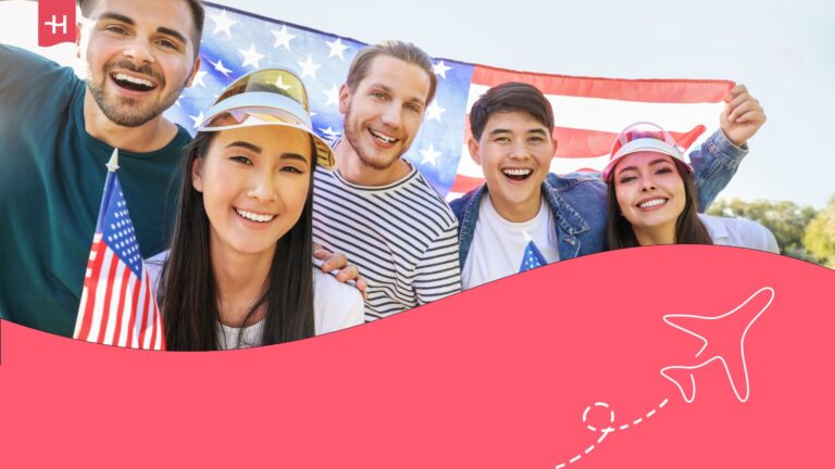 Group of people together holding up a United States flag.