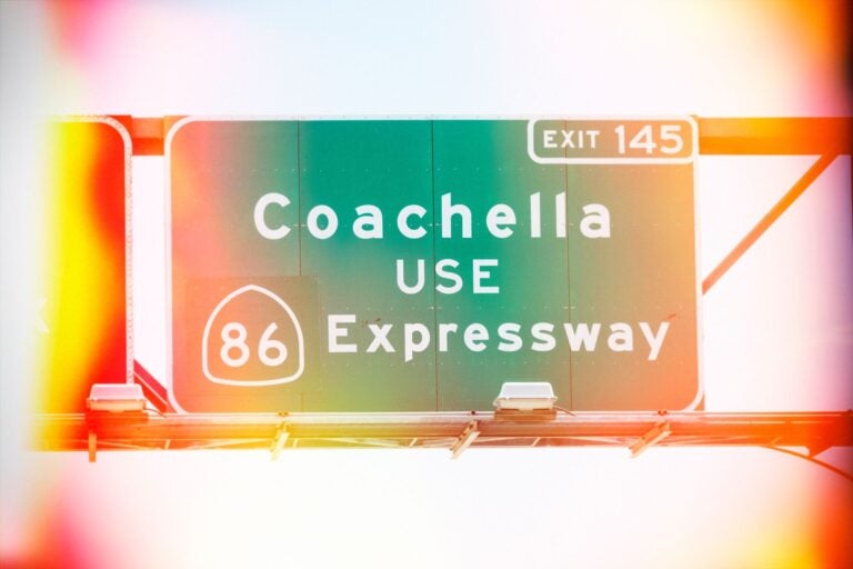 Faded road sign on Route 86 to Coachella. Note to use the Expressway via Exit 145. 