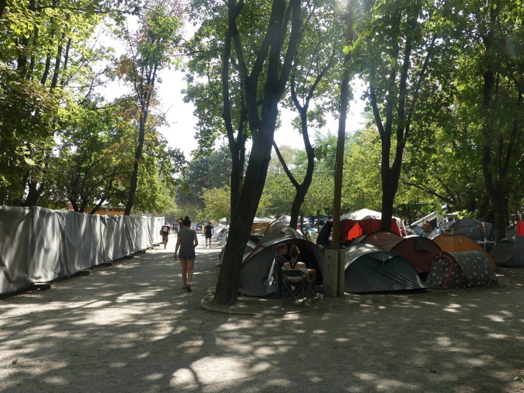 people walking around the camping site on the sziget festival