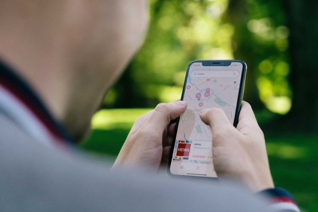 person looking at a map on their phone