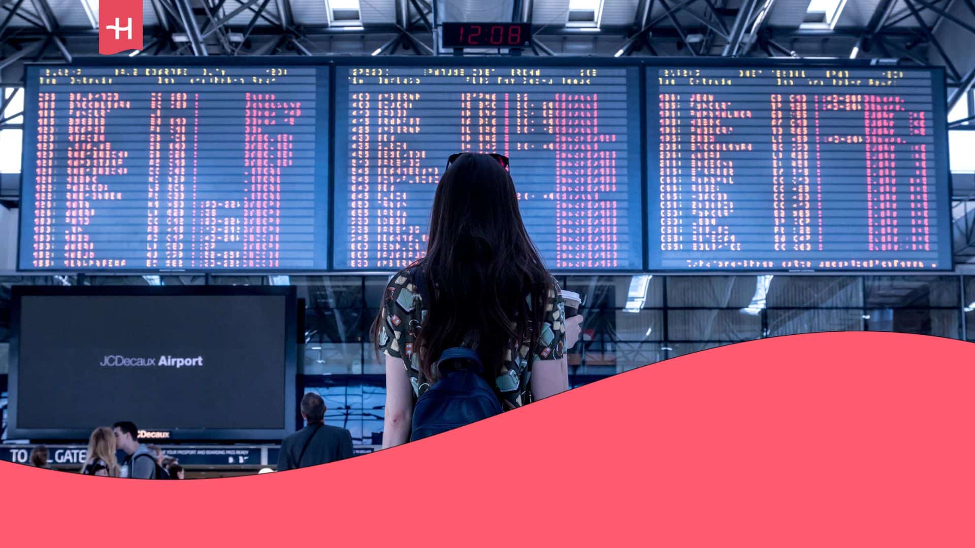 woman looking at airport international departure board