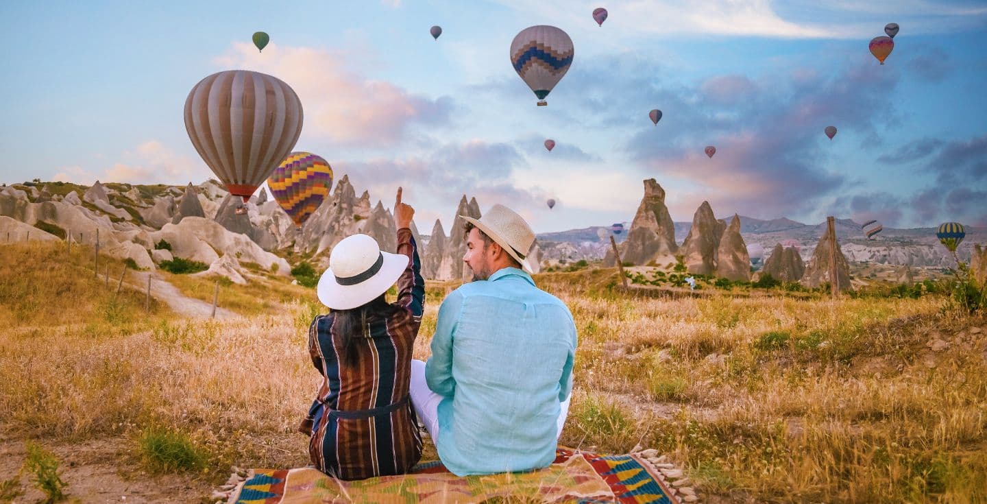 a couple enjoying cappadocia hot air balloons