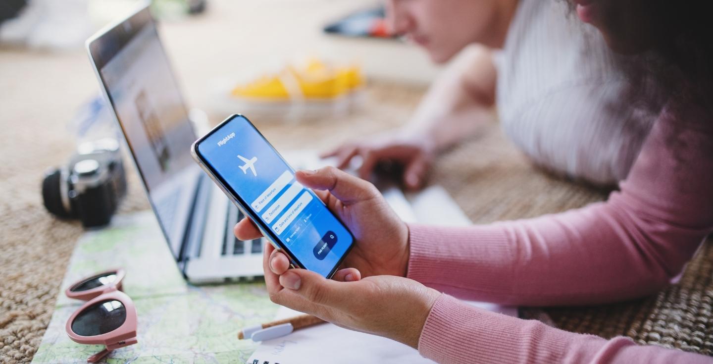 woman browsing for cheap flights on her phone