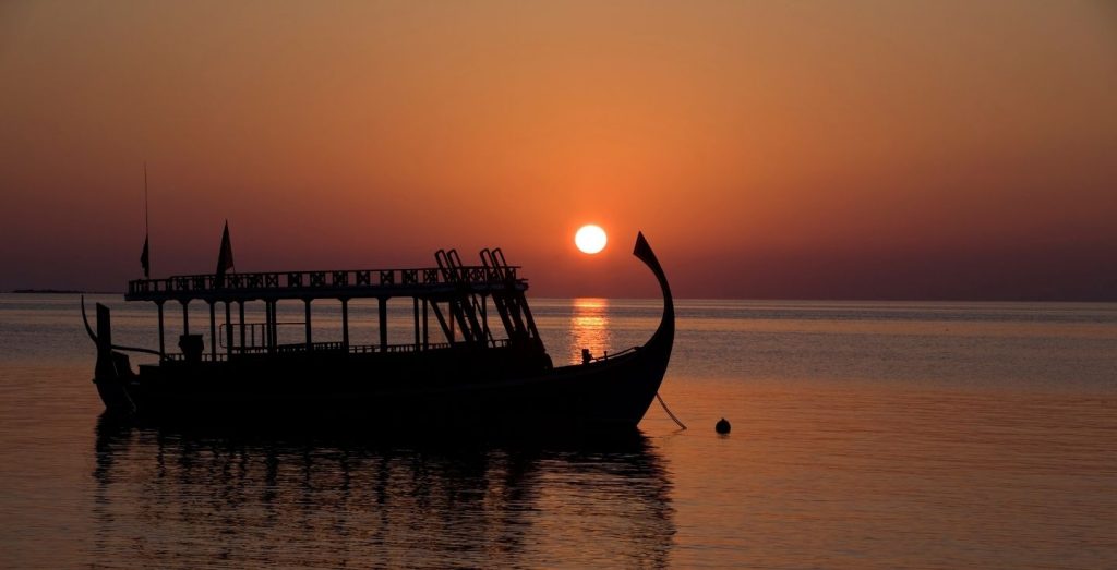 Maldivian dhoni boat in the sunset