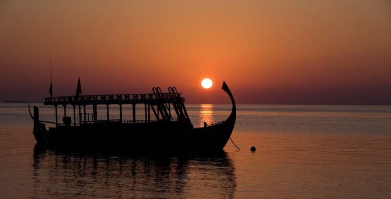 Maldivian dhoni boat in the sunset