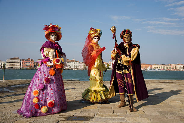 People in Venetian carnival costumes.
