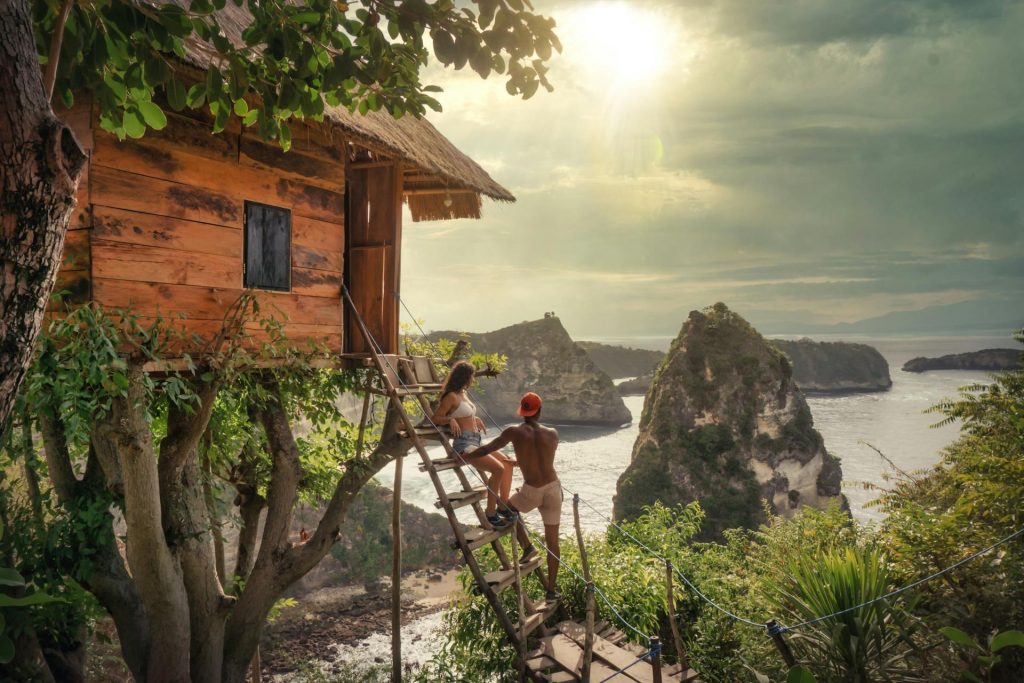 A couple outside of a private treehouse hotel room