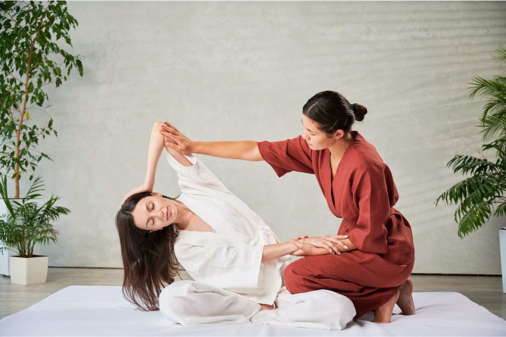 A Thai massage combines stretches, yoga, and pressure points