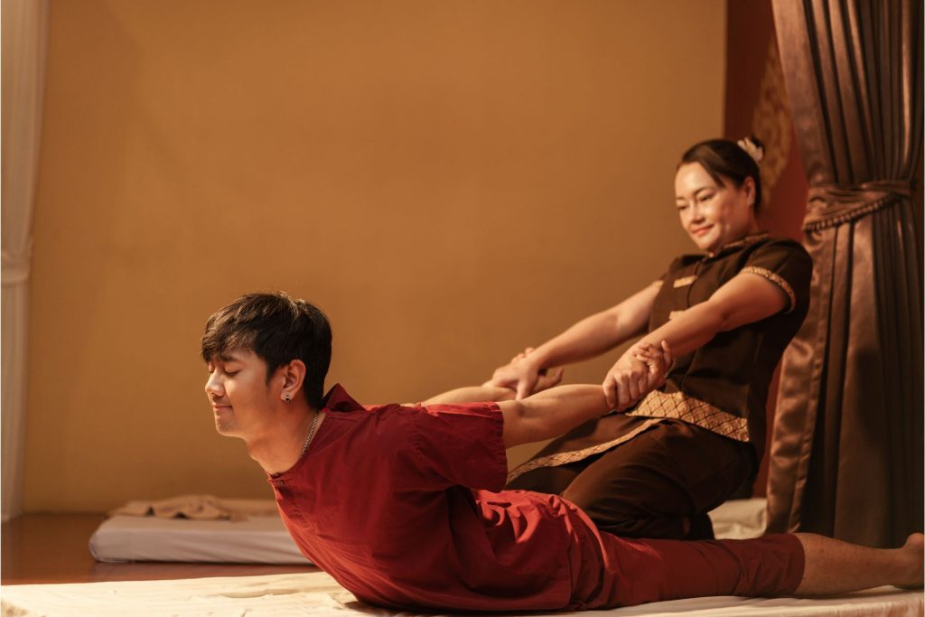 A man getting a traditional Thai massage