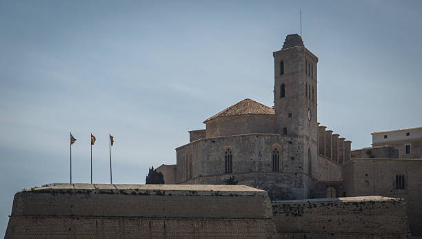 A side view of the Ibiza Cathedral, highlighting its Gothic architecture.