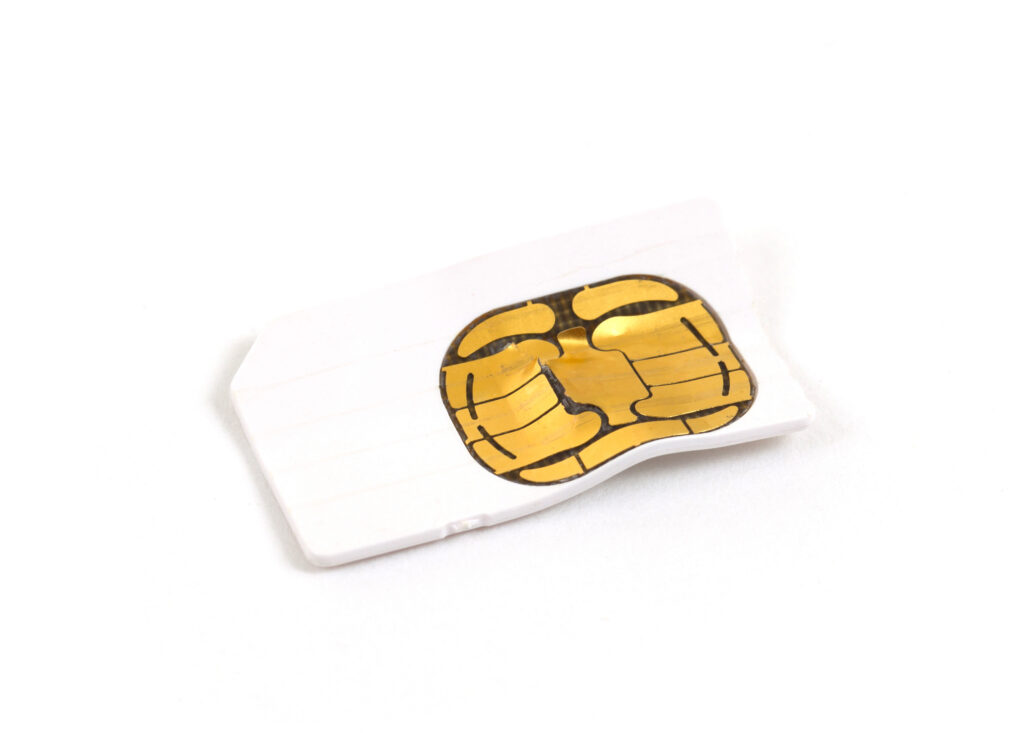 A SIM card with physical damage resulting from improper handling.