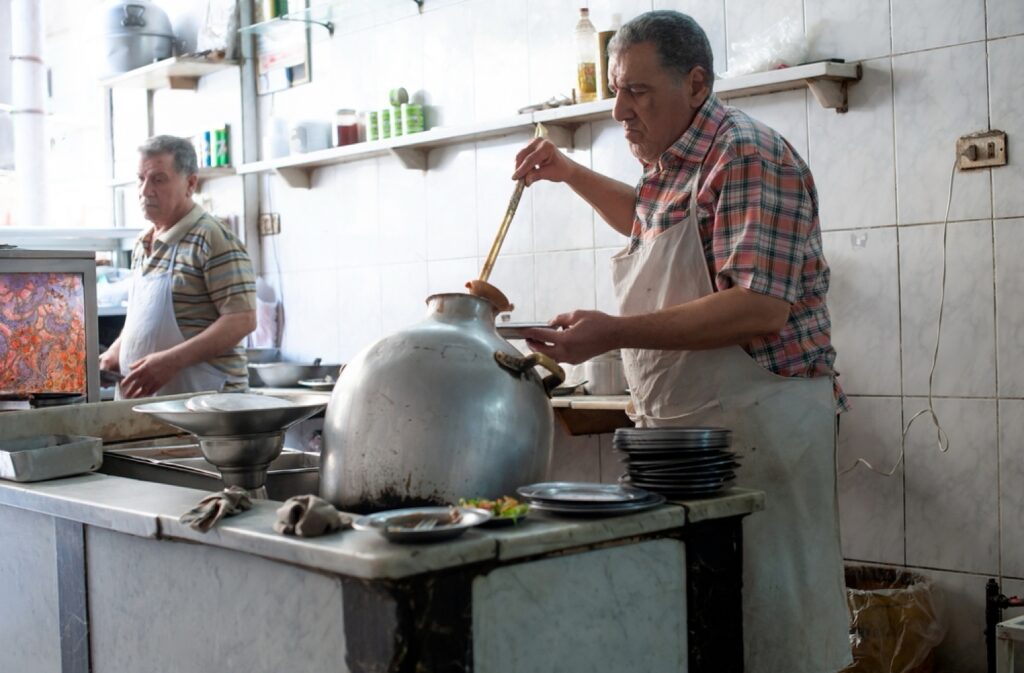 Cairo, Egypt. April 10th 2018 Mashed fava beans known as Fuul, Traditional Egyptian street food being served, Cairo, Egypt.
