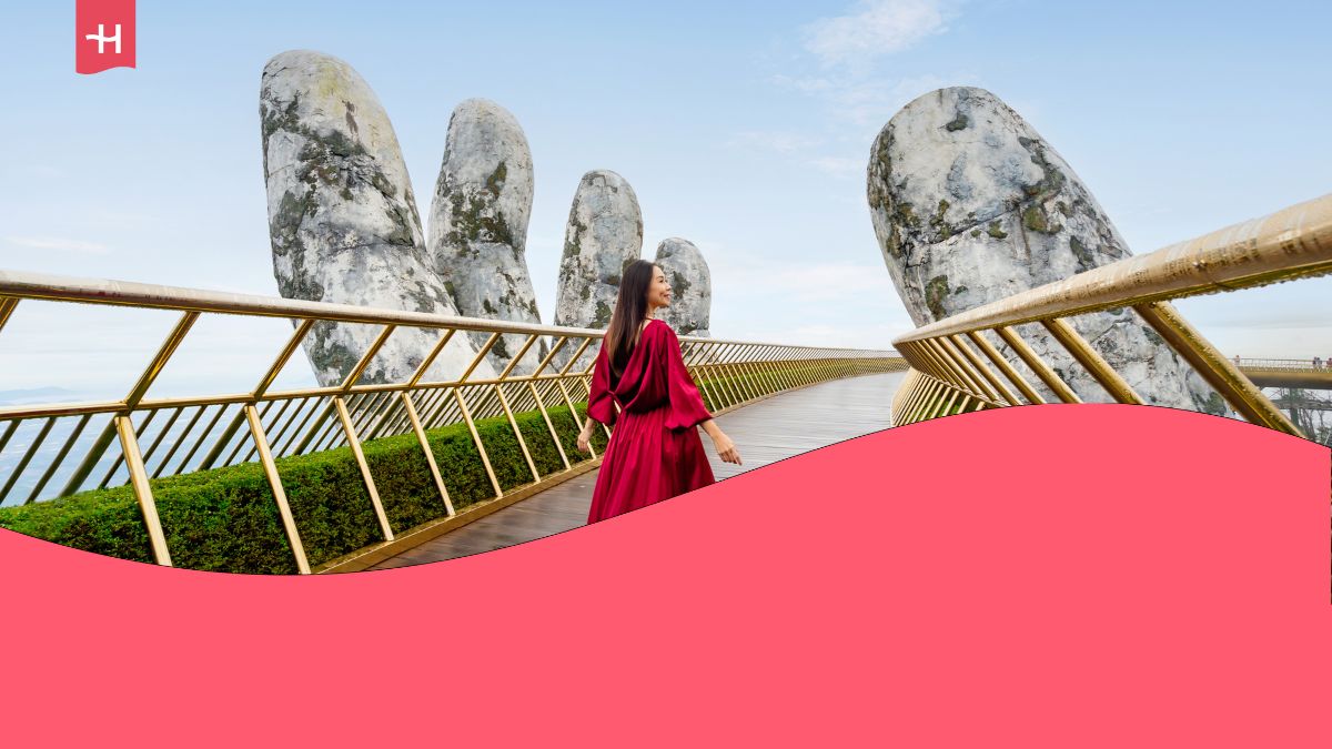 a woman in red dress posing on the Golden Bridge in Ba Na Hills, near Da Nan