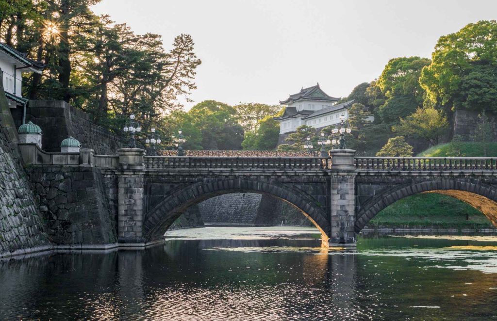 Looking at the The Imperial Palace in Tokyo across the river and bridge 