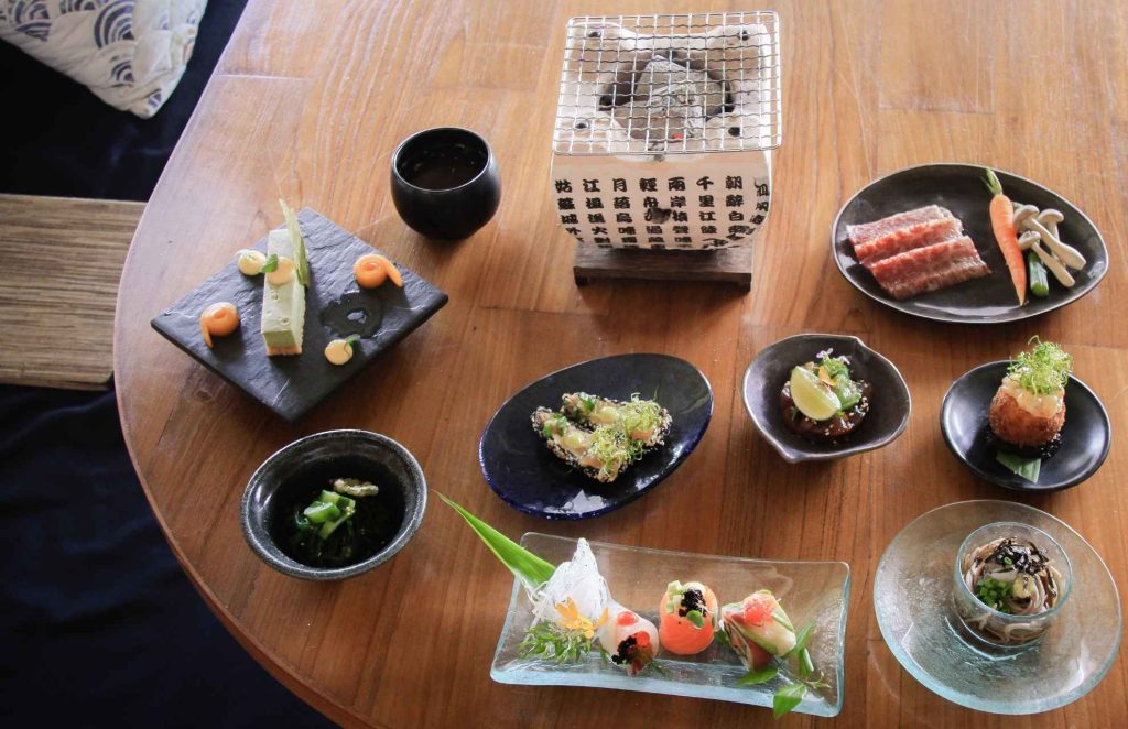 An above shot of kaiseki, a multi-course meal showcasing Japanese cuisine.