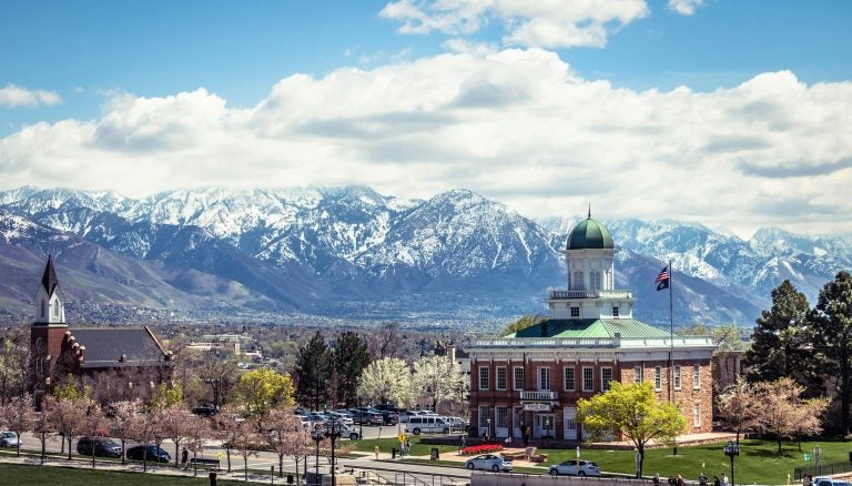 Some buildings in Salt Lake City, Utah, with the mountains in the distance. 