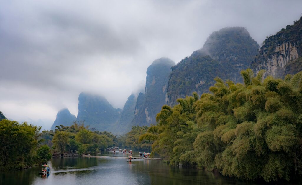 Tourists exploring the Li River on rafts in Guilin, China. Source: Pexels