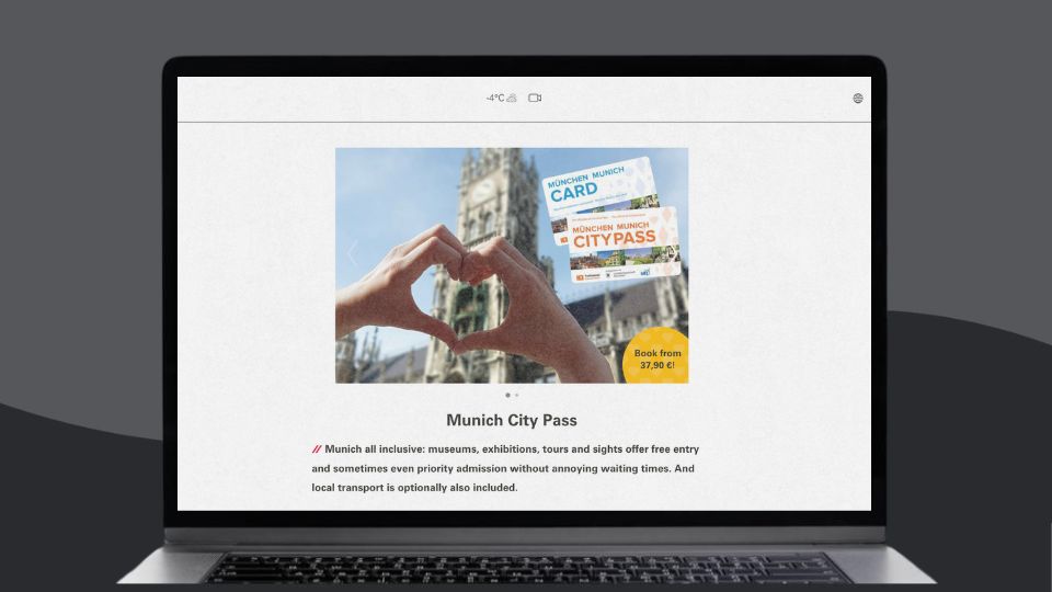 Laptop screen displaying the Munich City Pass website featuring two hands forming a heart with Munich’s historic architecture in the background.