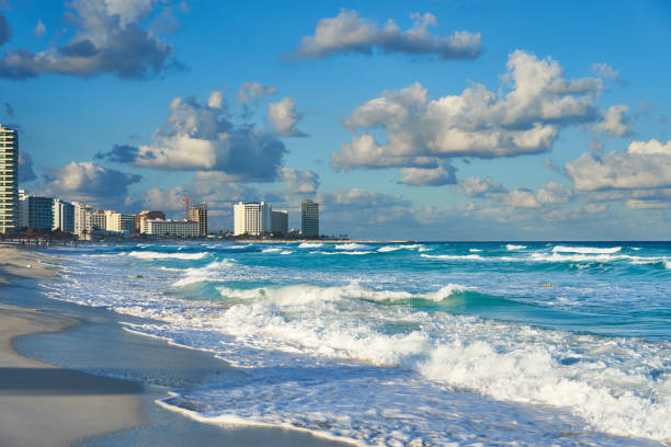 A wide-angle view of the blue skies and waters of the Chac Mool Beach. 