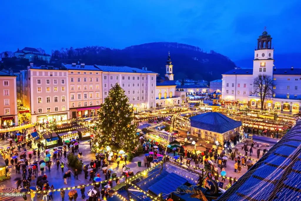 The Salzburg Christkindlmarkt in Austria brings holiday magic to life with its glowing Christmas tree.  Source: iStock