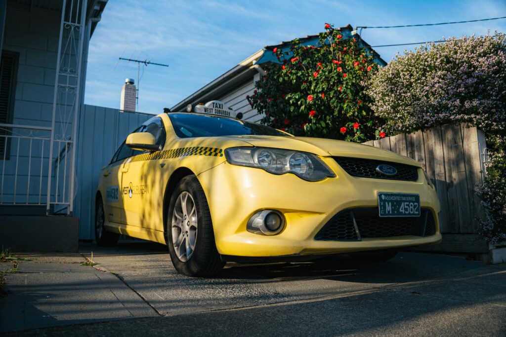 Yellow Taxi Parked in Yarraville Driveway