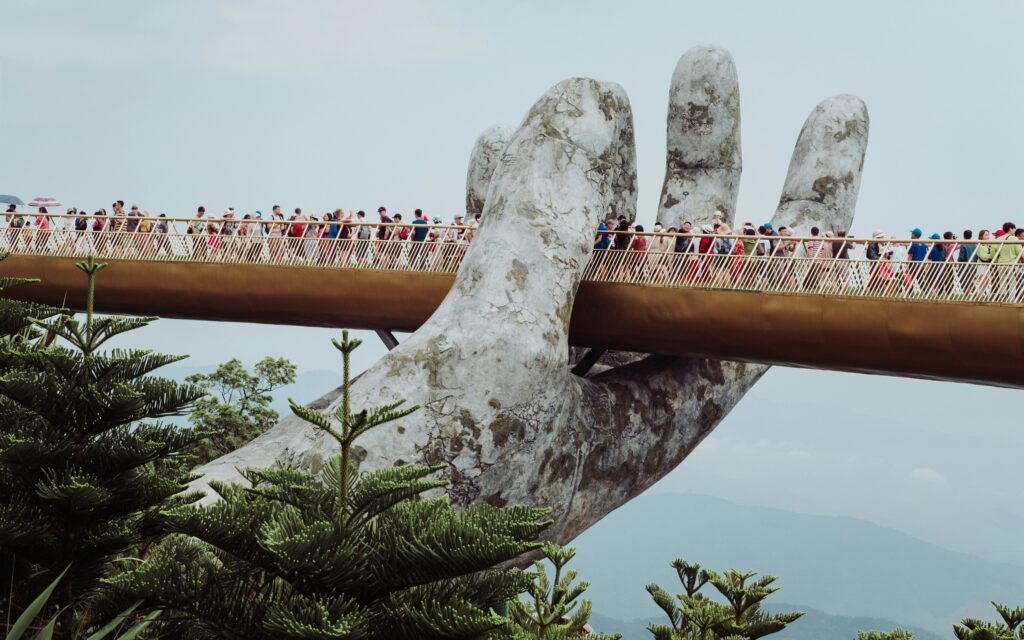 Tourists on the Golden Bridge, Ba Na Hills, Vietnam; Source: Unsplash