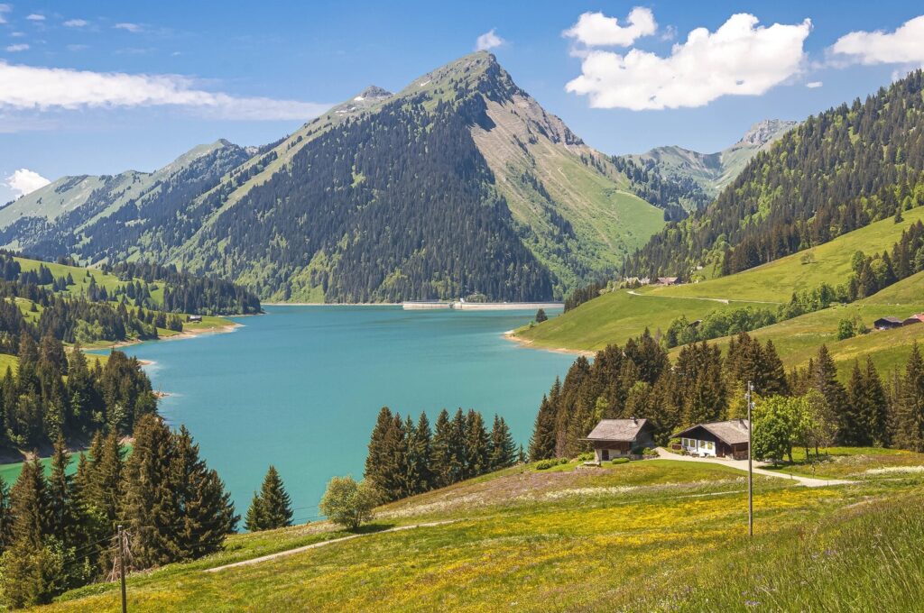 Beautiful view of a lake surrounded by mountains in Longrin lake and dam Switzerland, Swissalps