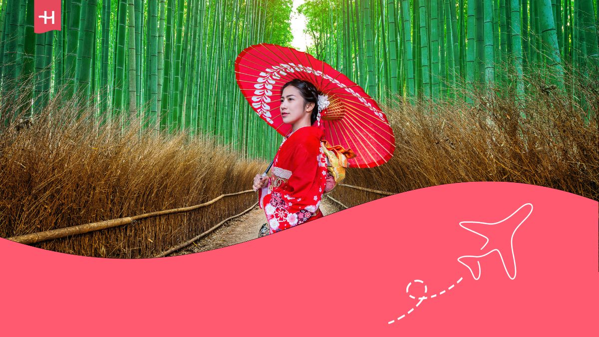 Asian woman wearing japanese traditional kimono at Bamboo Forest in Kyoto, Japan.