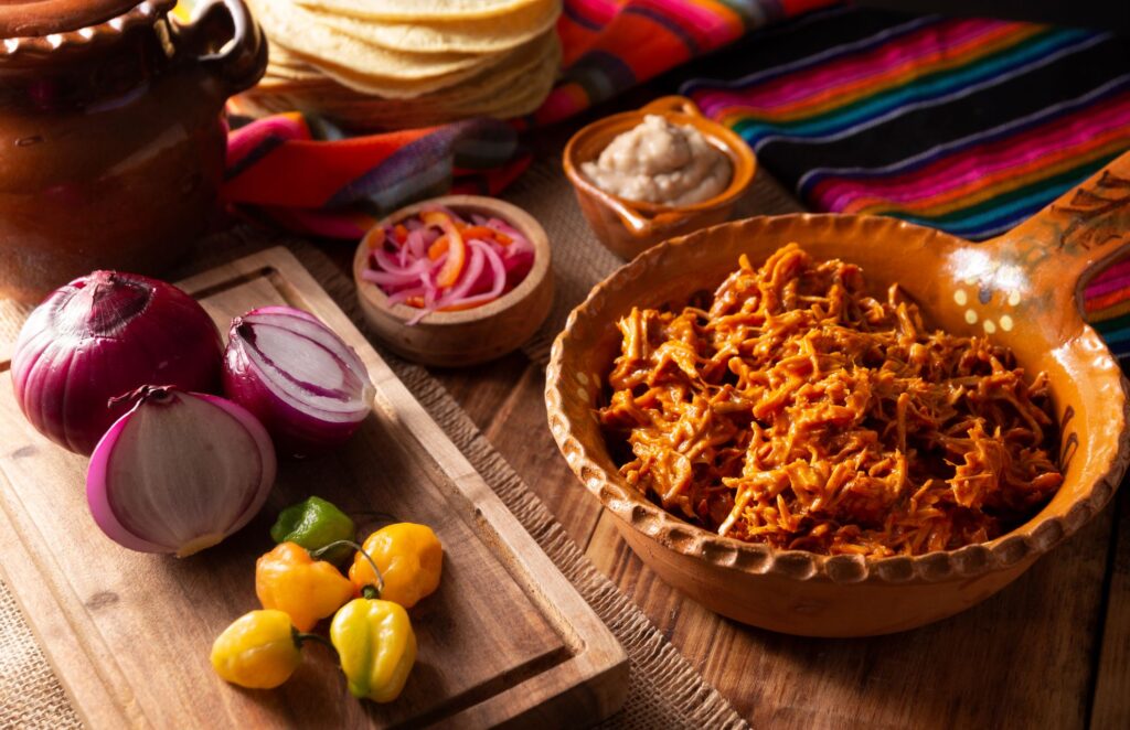 Cochinita pibil served with vegetables