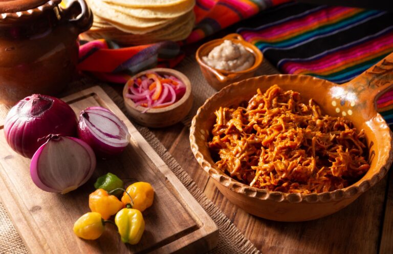 Cochinita pibil served with vegetables