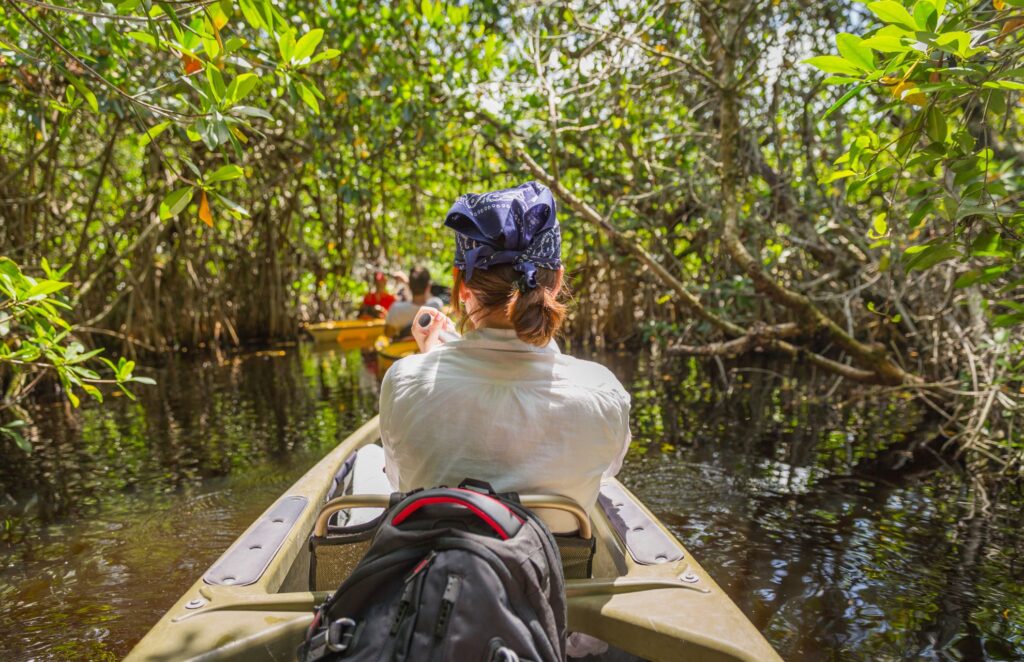 Woman in a kayak, going Mangrove kayaking in Costa Maya