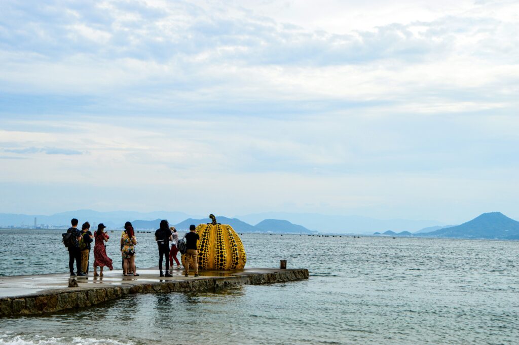 The famous pumpkin sculptures by artist Yayoi Kusama on Naoshima; Source: Unsplash