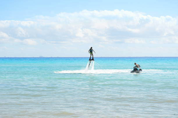 Tourists on flyboards and jet skis on Playa del Carmen, near Cancun. Source: Getty Images