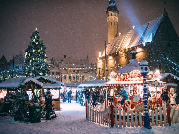 The Town Hall Square Christmas Market in Tallinn, Estonia, is a winter wonderland with snow-dusted stalls. Source: Jake Farra