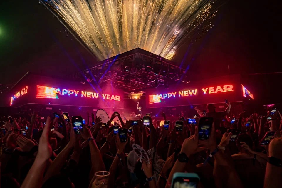 Fireworks light up the sky as crowds celebrate the New Year at Atlas Beach Club’s countdown party.