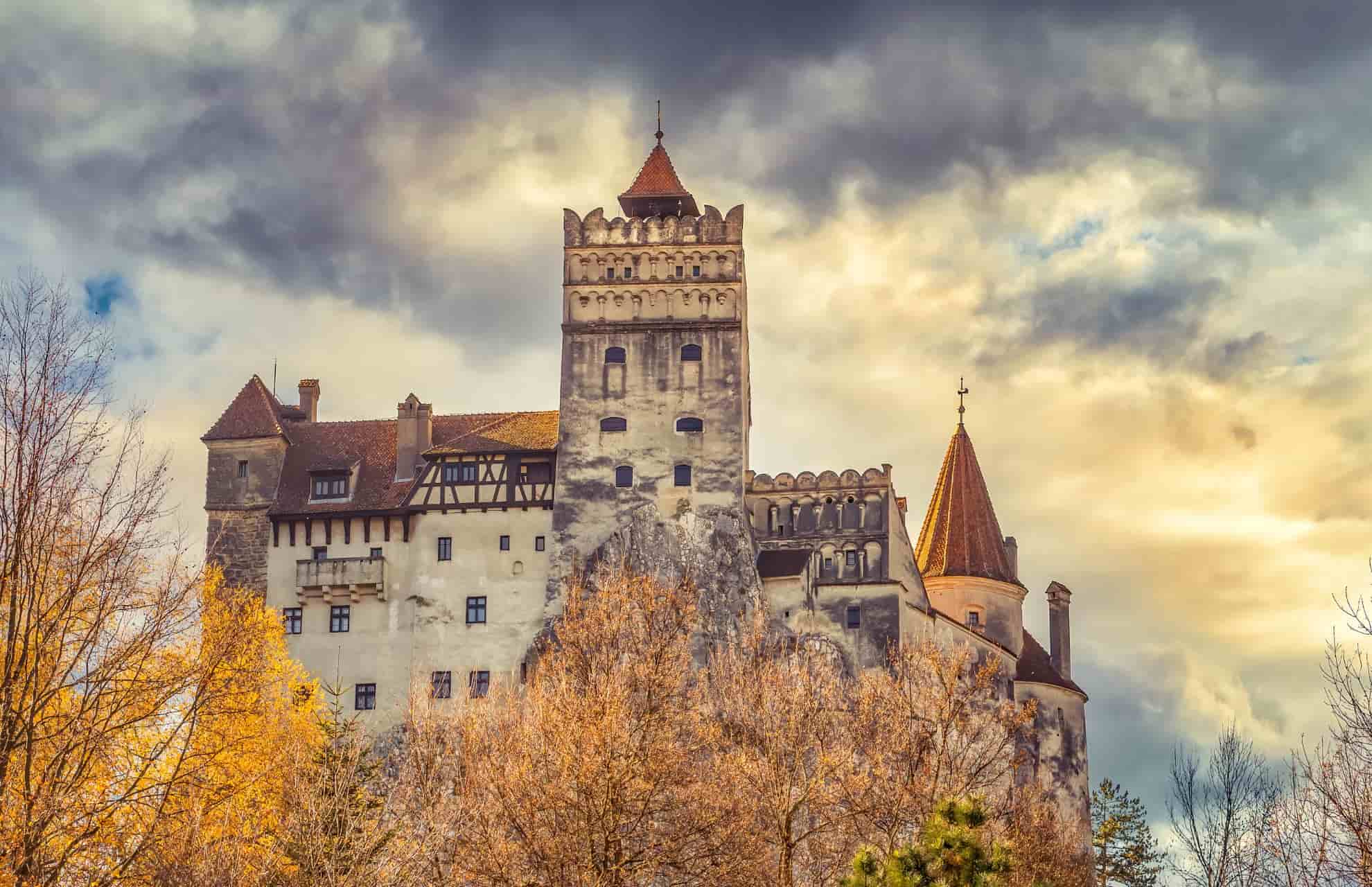 Tree-lined front shot of Bran Castle, Romania