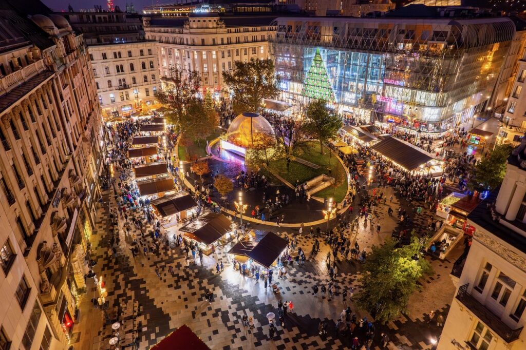 Festive lights and bustling stalls bring holiday magic to Budapest’s Vörösmarty Square Christmas Market.