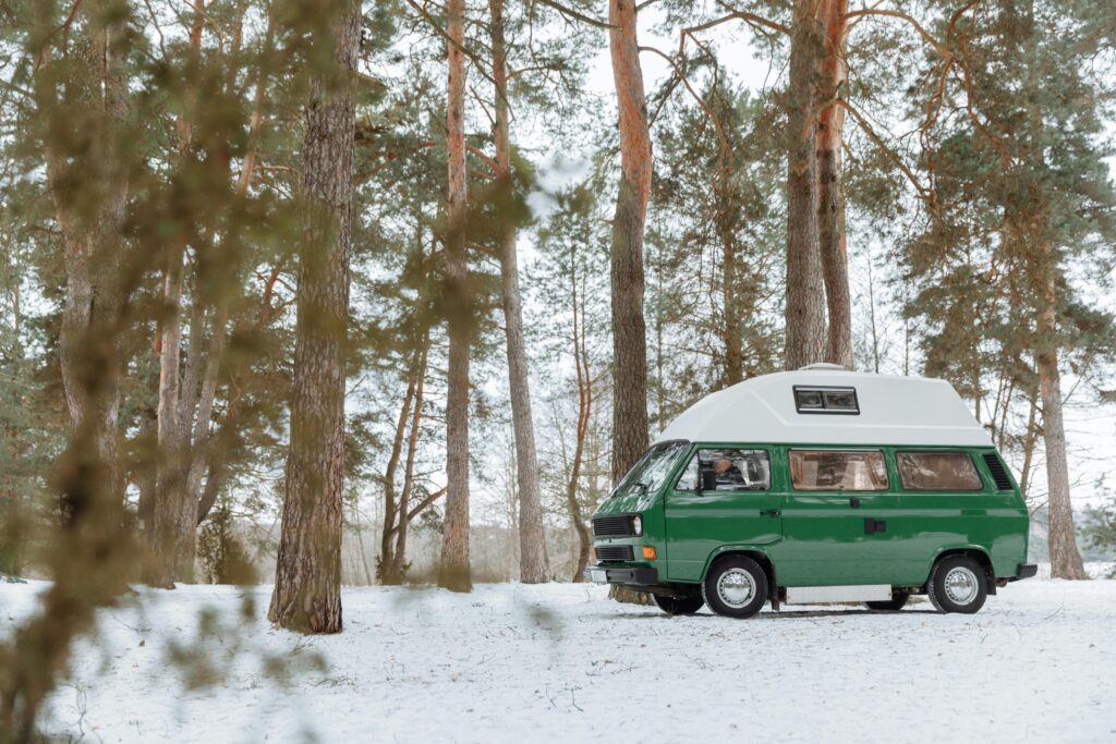 A campervan in a wooded area