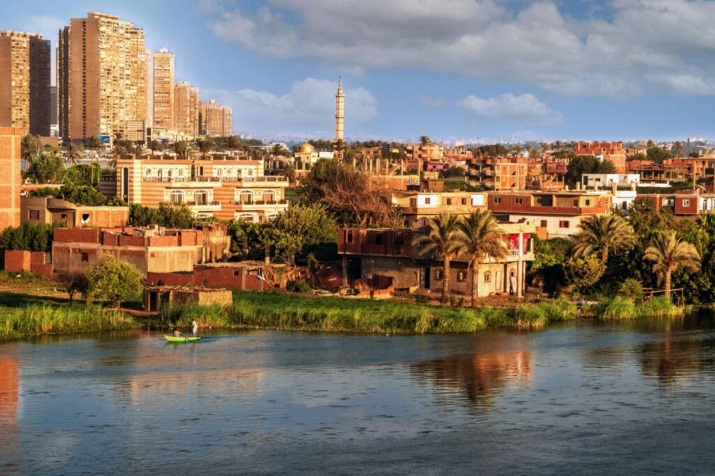 Buildings reflecting in the Nile