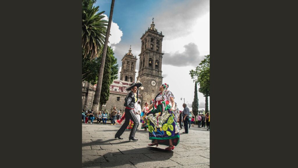 Traditional dance performance in front of Heroica Puebla de Zaragoza.