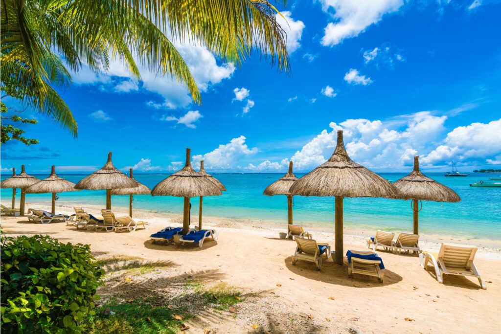 Lounge chairs and umbrellas on the Mont Choisy beach shoreline.