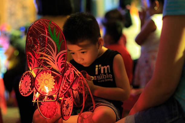 A child making a lantern during the Mid-Autumn festival; Source: iStock
