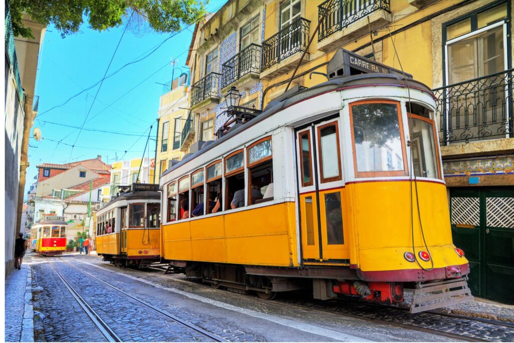 Shot of Lisbon, Portugal's famous cable cars along the city street.