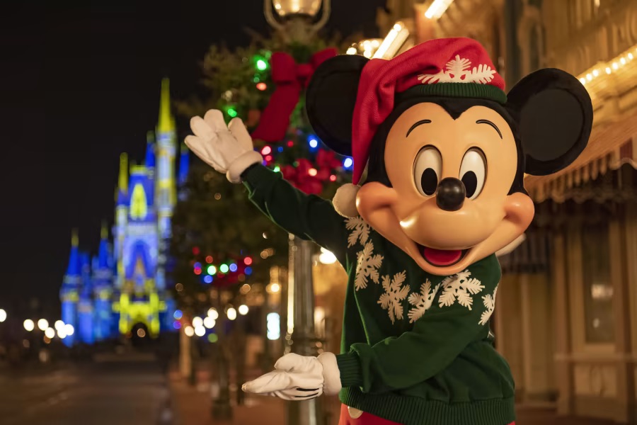 Mickey Mouse welcomes you to a festive holiday season at Walt Disney World Resort in Florida.