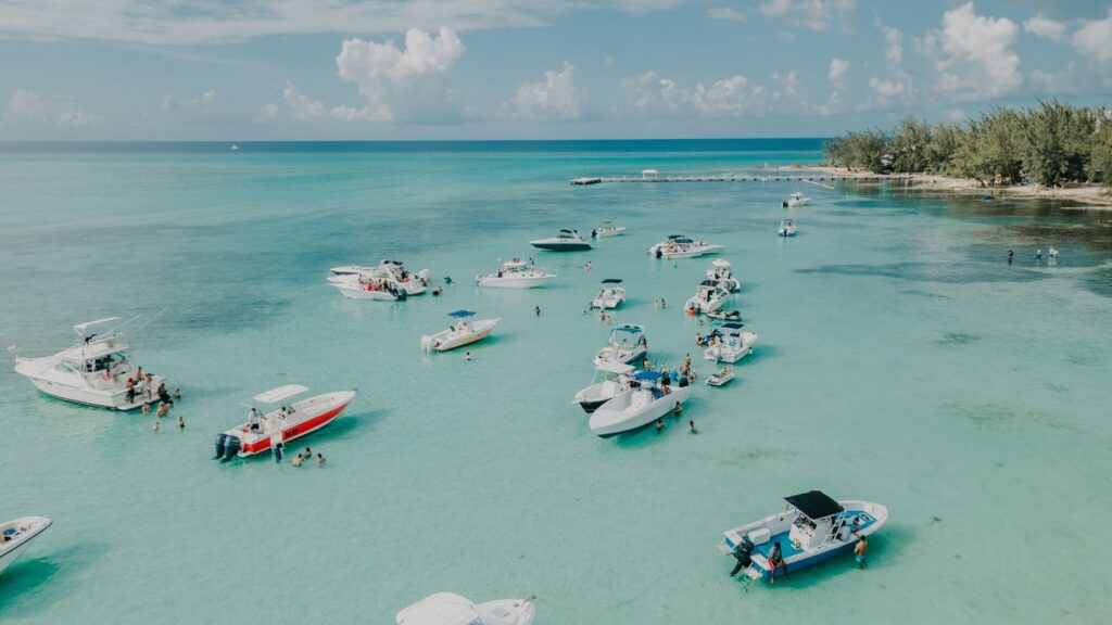 Sailboats and yachts help people tour the Cayman Islands 