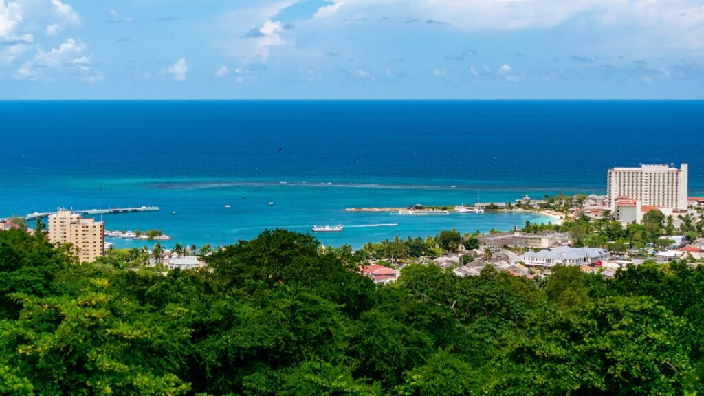 Lush green foliage and blue waters make up Jamaica's shores 