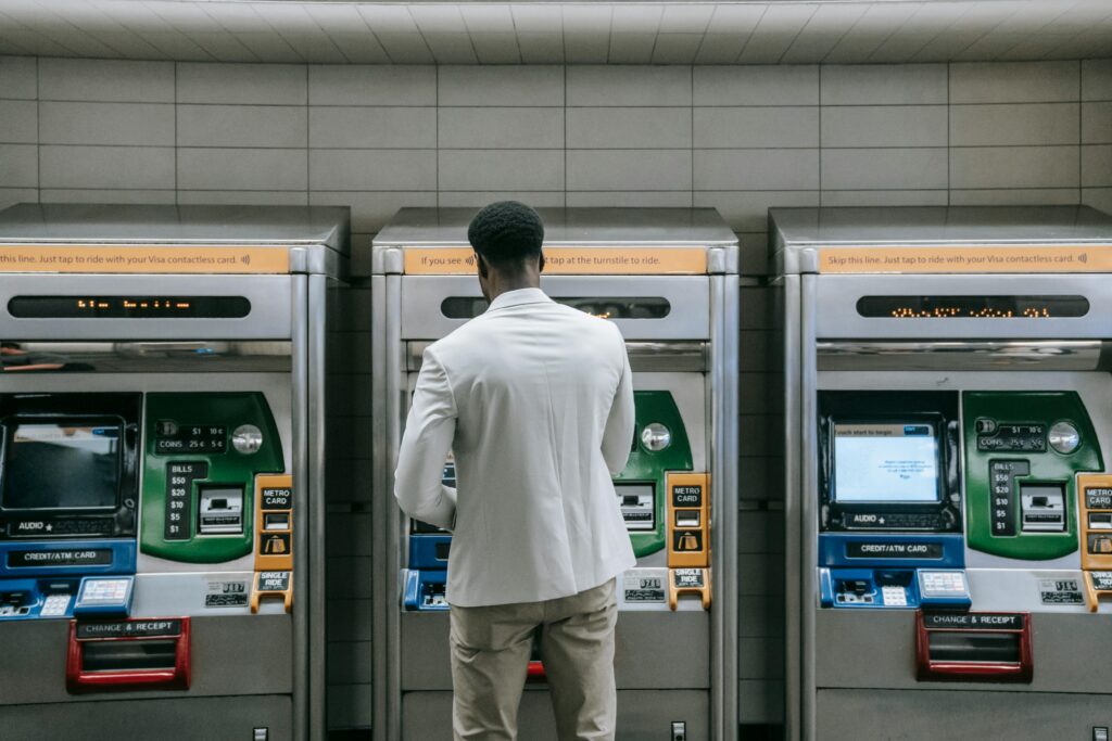 A passenger purchasing a train travel in Europe ticket from a ticket vending machine; Source: Pexels