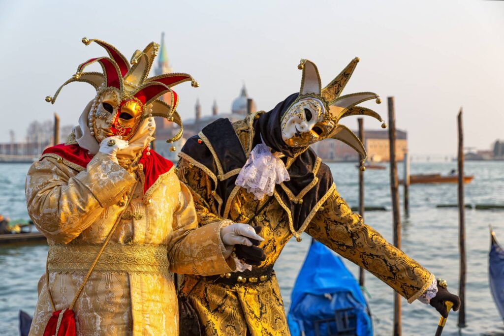 Venice Festival attendees dressed in traditional customs
